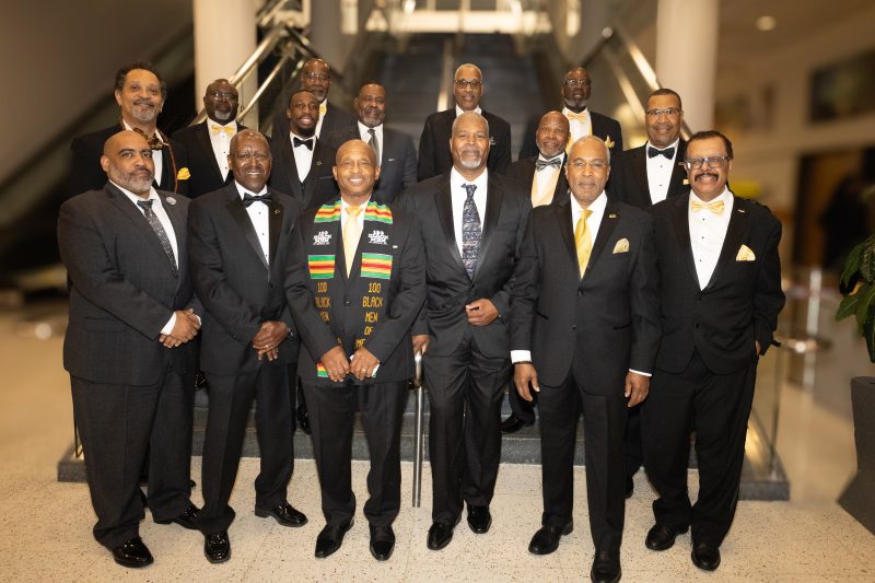 A group of men in suits and ties standing together