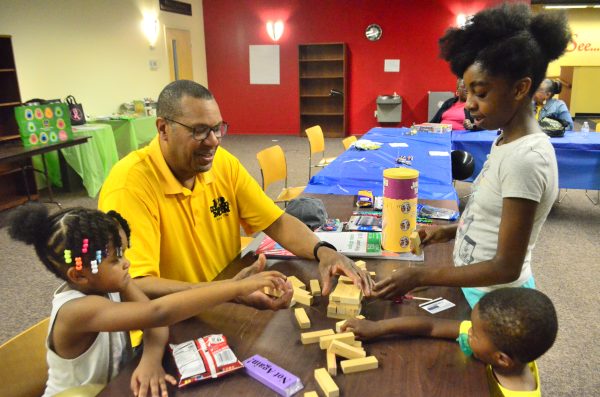 a mentor interacting with young children