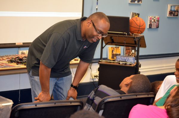 a mentor talking with a young student